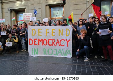 Krakow / Poland - October 12 2019: Demonstration Against Turkish Invasion In Syria, Activists And Local People With Flags Of  Autonomous Administration Of North And East Syria Called Rojava Also