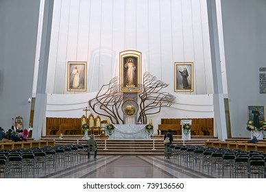 KRAKOW, POLAND - SEPTEMBER 12, 2017: Interior of Divine Mercy Sanctuary, a Roman Catholic basilica built in 2002 in Krakow, with famous Divine Mercy image above the main altar painted by Adolph Hyla.