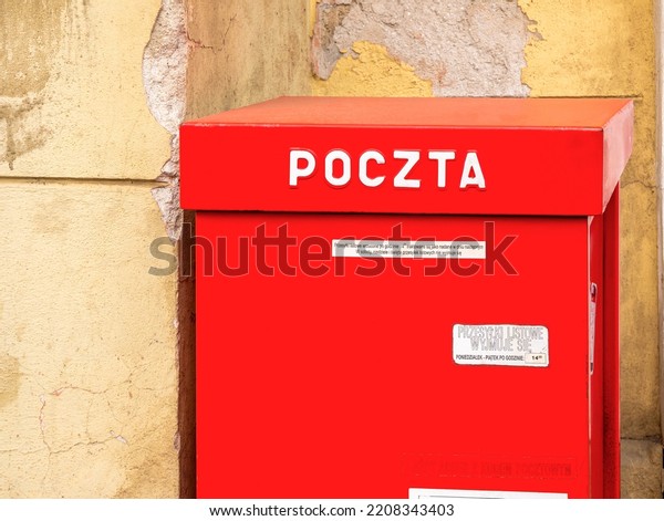 Krakow, Poland - September 2022: Poczta Polska,
Polish Post, state postal administration post office red postal
box. Traditional mail-handling large public mailbox, mail delivery
service concept