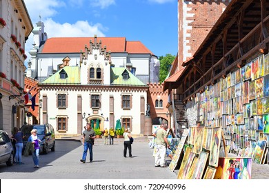 Krakow , Republic Of Poland- July 3, 2017: Trade In Painting Near The Fortress Wall Near St. Florian's Gate.