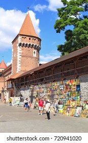 Krakow , Republic Of Poland- July 3, 2017: Trade In Painting Near The Fortress Wall Near St. Florian's Gate.