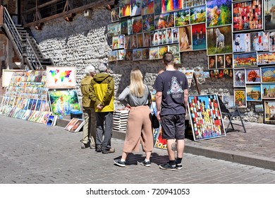 Krakow , Republic Of Poland- July 3, 2017: Trade In Painting Near The Fortress Wall Near St. Florian's Gate.