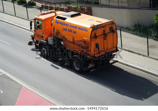 Krakow/Cracow/Poland - 14 June 2019: Street sweeper\
machine/car cleaning the\
road.
