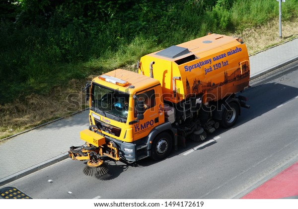 Krakow/Cracow/Poland - 14 June 2019: Street sweeper\
machine/car cleaning the\
road.