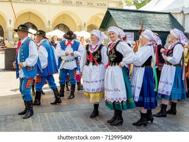 Krakow/Poland- August 15, 2017: Dancing Group – Men And Women, Wearing Traditional Clothes, Waiting For The Beginning Of Performance, On Celebration Of Polish Armed Forces Day At Main Market Square.