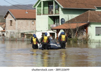 KRALJEVO, SERBIA - MARCH 8. 2016: Rescuers transport the flood victims after heavy rain and the river Morava flooded at Kraljevo, suburbs Grdica, on 8th March 2016.