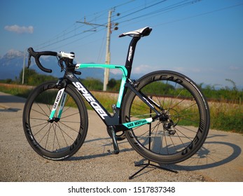 Kranj / Slovenia - September 2019: Professional Carbon Fibre Bike On The Street Near Railroad. Mountains In The Back.