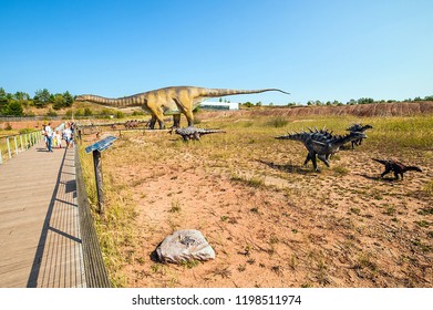 KRASIEJOW, POLAND - 21 August 2018 JuraPark - Theme Park In Poland Devoted To Dinosaurs. Visitors Passing By