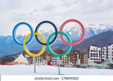 KRASNAYA POLYANA, SOCHI, RUSSIA - FEB 23, 2018. Landscape of a ski resort. Olympic rings in the snow against the background of Rosa Khutor. Winter.
