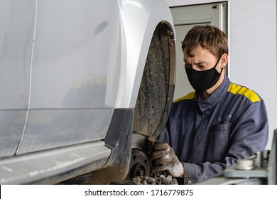 Krasnodar, Russia - April 28, 2020: Renault Auto Show In Adygea. Locksmith Works In Protective Mask. Maintenance Car Renault Duster. Quarantine. Coronavirus (Covid-19). Pandemic.