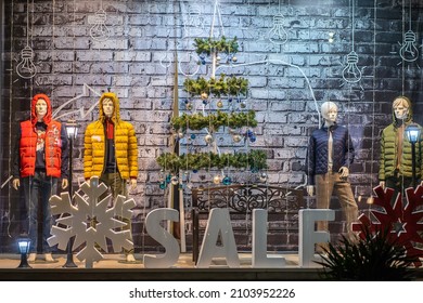 Krasnodar, Russia - January 3 2022: Word Sale In The Store Window With Mannequins In Winter Fashion.