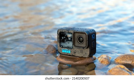 Krasnodar, Russia - March 03 2022: GoPro 10 In The Splashing Water On The River. Action Camera In Extreme Conditions, The Splatter On The Camera.