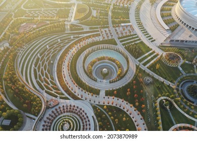 Krasnodar, Russia - October 27 2021: Aerial View. Galitsky Park In Autumn. Patterns, Walking Areas, Urban Sculptures, Gardens Exotic Trees, Rapids, Fountains And Labyrinths From Drone. Futuristic City