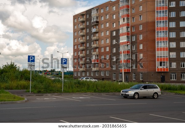 Krasnoyarsk,
Krasnoyarsk Region, RF - July 20, 2021: The car stands near the
parking lot for the disabled against the background of a
residential building in the
summer.
