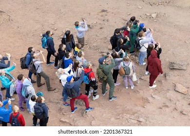 Krasnoyarsk, Russia - 11 September, 2022: Crowd Of People In Sportswear With Backpacks Taking Pictures On A Smartphones. Multitude Of People Attentively Observing And Take Pictures At The Same Time