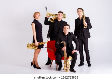 Krasnoyarsk, Krasnoyarsk / Russia - 11/01/2019: Saxophonists Musical Quartet With Saxophones In Studio