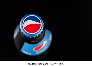 Krasnoyarsk, Russia February 23, 2020: Pepsi bottle-top view of the cork and label, close-up black background. free empty space for text, copyspace