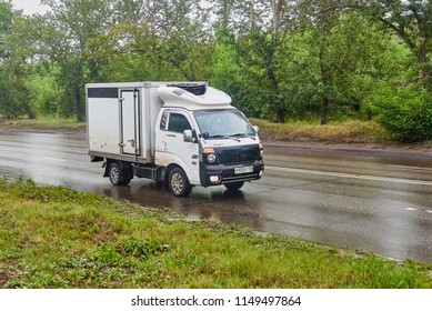 Krasnoyarsk, Russia - July 30, 2018: Kia Bongo 2 Passing On The Wet Road To A Rain.