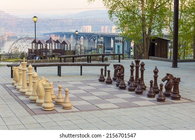Krasnoyarsk, Russia - May 13, 2022: Outdoor giant chess board with big plastic pieces on the territory of the museum-estate of G. V. Yudin