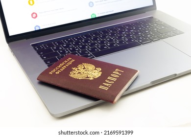 Krasnoyarsk, Russia - May 23,2022: Passport Of Russian Federation On Keyboard Of MacBook.Identification Of The User On The Internet. Registration By Passport In The Russian Government Services Portal