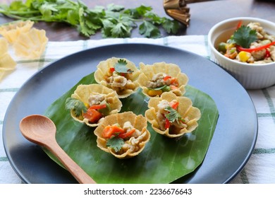 Kratong Thong - Mini crispy cup made from flour and filled with minced chicken and vegetable - Thai authentic appetizer - Shutterstock ID 2236676643