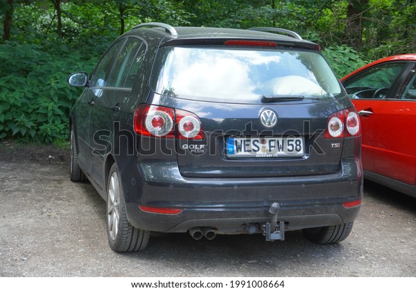 Krefeld,Germany-June 11,2021: Volkswagen Golf Plus\
GTI parked near forest,is a Station wagon manufactured and marketed\
by Volkswagen since\
2005