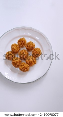 kremes, snack grubi is made from sweet potatoes and palm sugar in white plate with white background. Indonesian snack  Zdjęcia stock © 