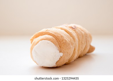 A kremrole or cream roll. A traditional pastry dessert tube filled with cream or meringue and served in central Europe, Czechia, Slovakia and Austria