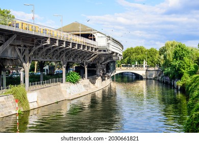 Kreuzberg, Berlin, Germany - August 24, 2021: View of the Hallesches Tor metro station and east along the Landwehr canal towards the Hallesches Tor bridge