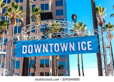 Kristi Yamaguchi Downtown Ice sign advertises outdoor skating rink under palm trees - San Jose, California, USA - 2021