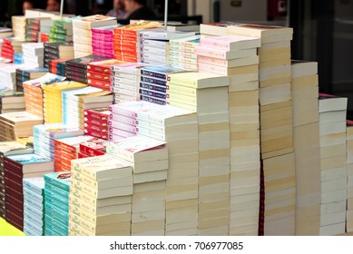 Kristiansand, Norway - August 16, 2017: Travel Documentary Of Stack Of Paperback Books On Sale Outside Book Store.