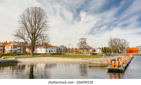 Kristiansand, Norway - June 4, 2015: Sandy Beach On The Fjord. Empty Waterfront. Places For Boats. Gulf Of Kristiansand.