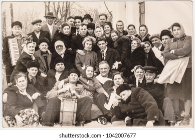 KRIVOY ROG, USSR - CIRCA 1970: Large Group  People On Country Wedding Having A Fun At Cold Winter Outside. The Bride And Groom Are Surrounded By Guests. Many People, Folk, Retro, Vintage, Countryside