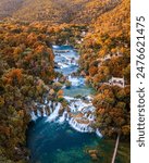 Krka, Croatia - Aerial panoramic view of the beautiful Krka Waterfalls in Krka National Park on a bright autumn morning with colorful autumn foliage and turquoise blue water