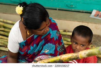 K.R.Market,Bengaluru, India -14-08-2022:Top View Of Kid Looking Side And Upset And Mom Looking At His Son