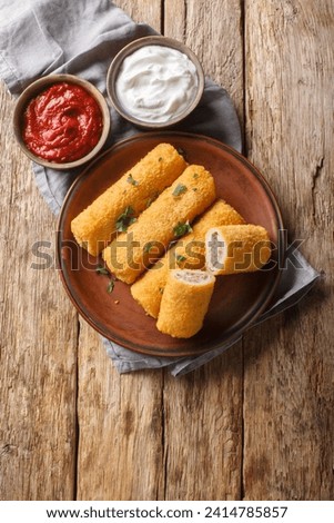 Krokiety Polish style croquettes filled with beef closeup on the plate on the wooden table. Vertical top view from above
 Zdjęcia stock © 