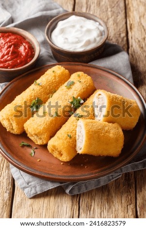 Krokiety Polish style croquettes filled with beef closeup on the plate on the wooden table. Vertical
 Zdjęcia stock © 