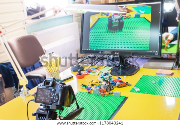 KROPIVNITSKIY, UKRAINE – 12 MAY, 2018: Stop motion\
animation process with Lego details and toy cars. Computer monitor,\
stop motion elements to create animations using a DSLR camera on\
table