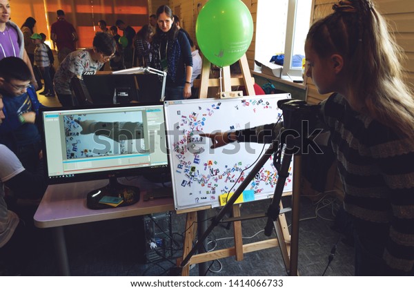 Kropivnitskiy,\
Ukraine – 12 May, 2018: Girl making Stop motion animation process\
with magnetic letters, paper alphabet on board and computer monitor\
with the program for creating\
animations.