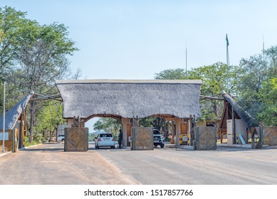 KRUGER NATIONAL PARK, SOUTH AFRICA - MAY 18, 2019: The Phalaborwa entrance/exit gate of the Kruger National Park. Vehicles are visible