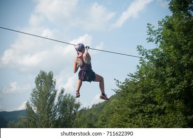 Kruth - France - 25 August 2017 - woman slides on a cable