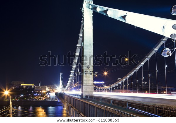 Krymsky Bridge or Crimean\
Bridge (night) is a steel suspension bridge in Moscow, Russia. The\
bridge spans the Moskva River 1,800 metres south-west from the\
Kremlin
