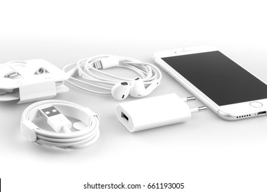 KRYNICA ZDROJ, POLAND - JUNE 13, 2017: Iphone 7  silver serie , Apple inc new smartphone with charger, earphones and adapter on white background.