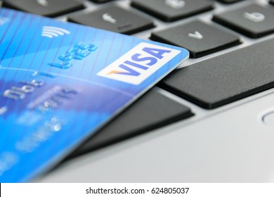 Krynica-Zdroj, Poland - April 20, 2017: Concept of online payment by Visa Credit Card. Visa Inc. is an American multinational financial services corporation. 