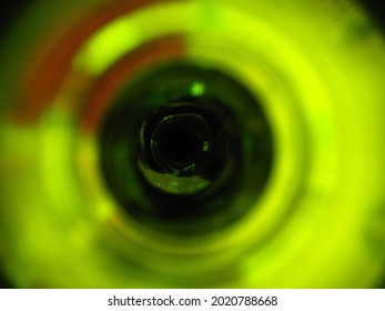 Kryptonite - Abstract close-up photograph of the inside of a green bottle. 