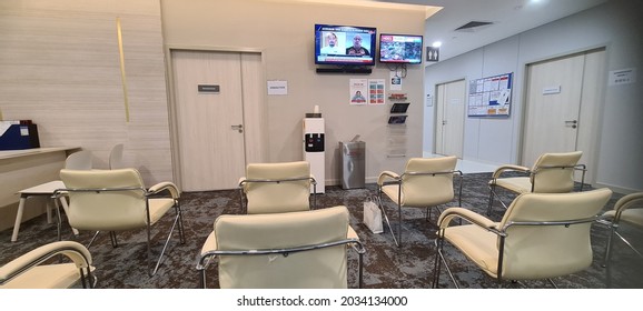 Kuala Lumpur 12th August 2021 : Sunway Medical Centre Velocity Health Screening Receptionist Counter At Second Level With Patient And Nurse Attending With Social Distance Chair Setting For Patient