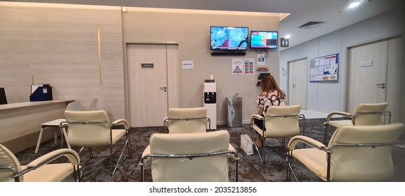 Kuala Lumpur 12th August 2021 : Sunway Medical Centre Velocity Health Screening Receptionist Counter At Second Level With Patient And Nurse Attending With Social Distance Chair Setting For Patient