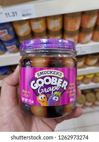 Kuala Lumpur, 18 December 2018:  Holding A Jars Of Smucker's Brand Goober. Peanut Butter And Jelly Mixed In The Same Jar.