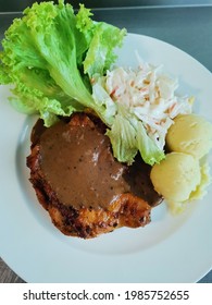 Kuala Lumpur, 22 May 2021. A Serving Of Grilled Chicken Chop With Black Pepper Sauce Accompanied With Two Scoop Of Creamy Mashed Potato, Salad And Coleslaw. A Good Choice For Healthy Lunch. 