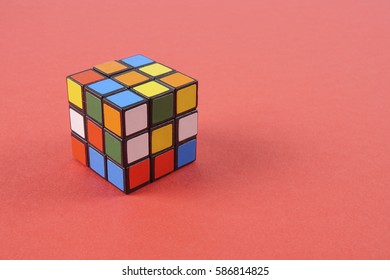 Kuala Lumpur, 24 February 2017.Rubik Cube Isolated On Red Background. Problem Solving Concept.